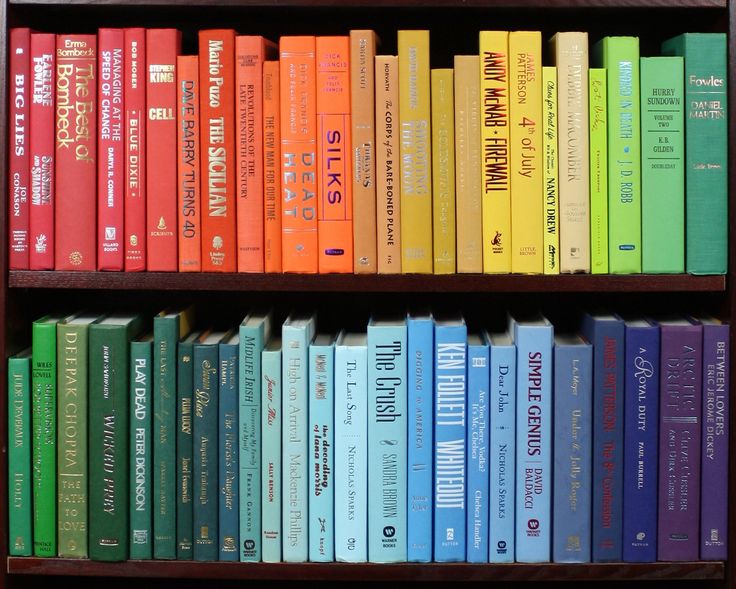 a book shelf filled with lots of colorful books on top of eachother's shelves