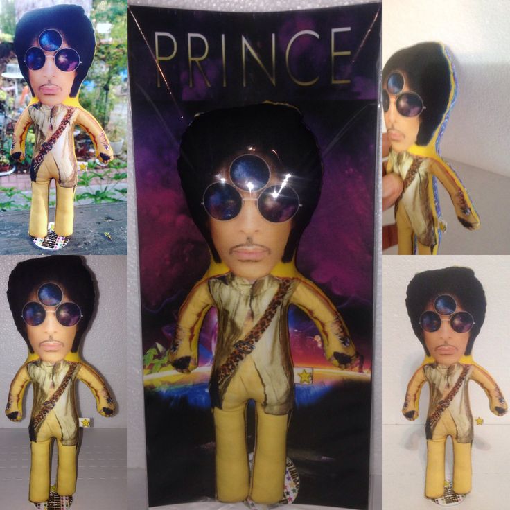 the prince doll is wearing sunglasses and holding a guitar