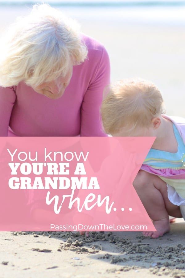 a mother and her baby playing in the sand with text that reads, you know you're a grandma when