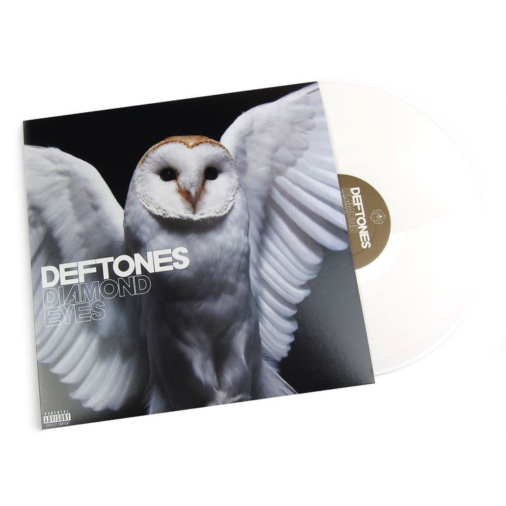 an owl with its wings spread out and the words deftones on it's back