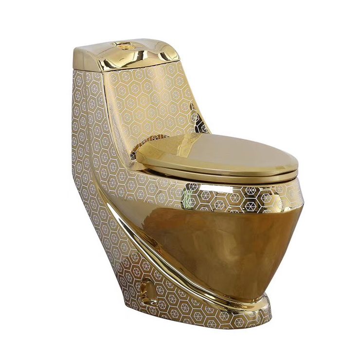 a gold toilet with an artistic design on it