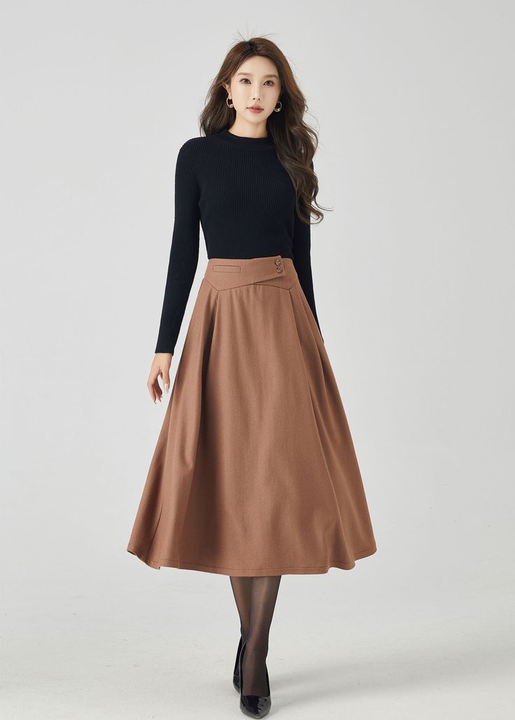 "Discover our classic brown wool A-line skirt, a timeless addition to your winter wardrobe. The rich brown color exudes sophistication, while the premium wool fabric ensures warmth and comfort. This versatile A-line skirt is perfect for both work and casual outings, making it a must-have choice for staying chic and cozy. DETAILS * 30% wool blend, 40% fiber and polyester, 40% nylon * Full polyester lining * Without pocket * Back zipper closure * Vintage inspired skirt * Suitable for autumn and winter  * Mid calf length * Dry clean MODEL SIZE Bust 85 cm(33.4\") Waist 67 cm(26.7\") Height 168cm (5' 6\") She wears size XS Choose CUSTOM Order if you * Need other color * Can't find your size in our size Chart * Chang the Length * Your Height is not Between 5'1\" - 5\"9\" * Your weight is not fro Knee-length Maxi Skirt For Workwear In Fall, Elegant Fall Maxi Skirt For Office, Winter Workwear Lined Maxi Skirt, Winter Workwear Maxi Skirt With Lining, Lined Maxi Skirt For Winter Workwear, Fall Workwear Lined Maxi Skirt, Beige A-line Pleated Skirt For Fall, Chic Brown Maxi Skirt For Fall, Classic A-line Pleated Skirt For Fall