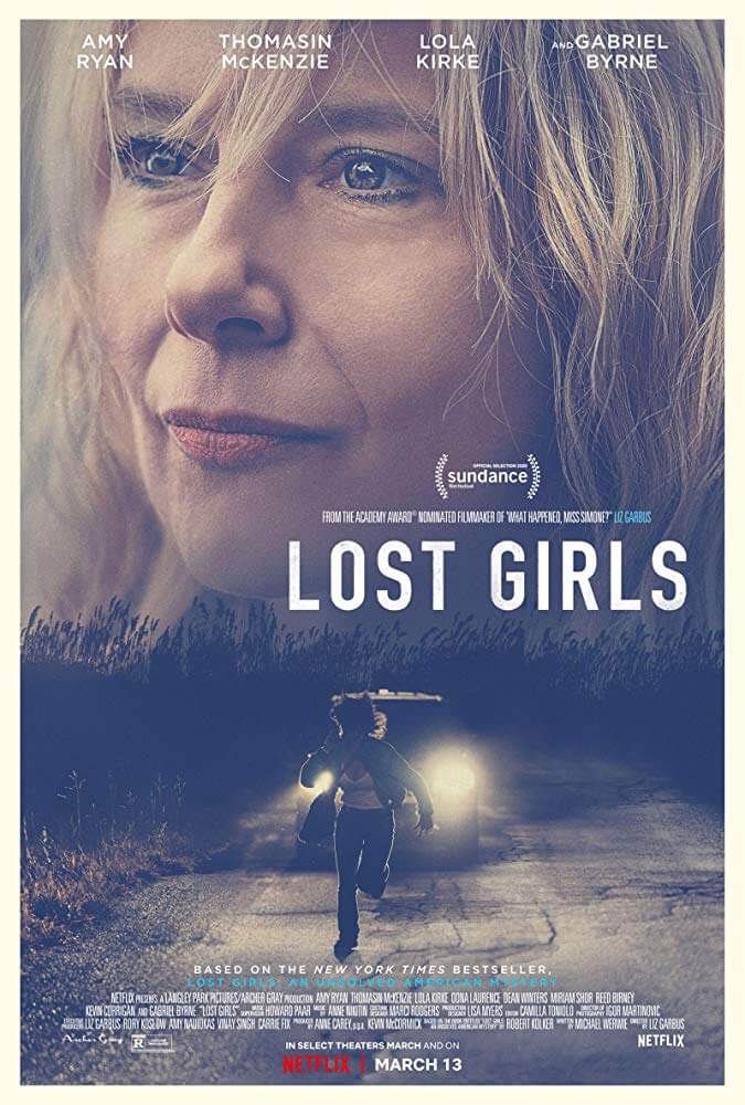 the movie poster for lost girls with a woman standing in front of her car and looking at