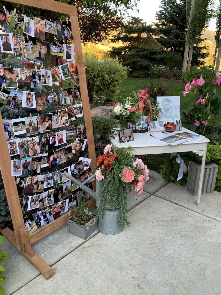 a table with flowers and pictures on it