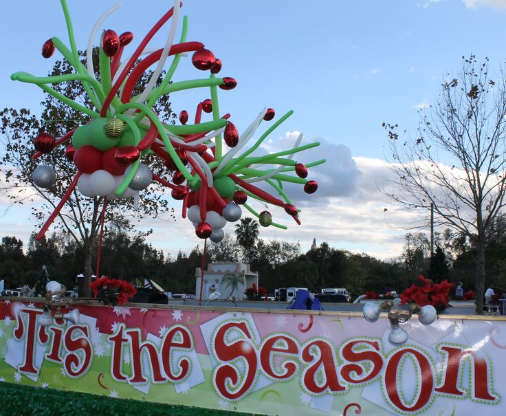 an outdoor christmas display with balloons and decorations