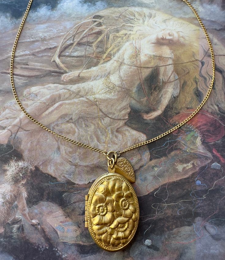 "What a stunning solid brass awesome detailed bold raised relief Floral Locket with Heart Charm. Great quality. Nice weight piece. These designs are from stampings tooled at the turn of the last century. Stunning! 14\" in length  Locket 1 1/2\" in size  Great nostalgic piece.  If you buy more than 5 items in the store, shipping is FREE." Gold Etched Victorian Locket Necklace, Handmade Brass Gold Locket Necklace, Traditional Gold Medallion Locket Necklace, Handmade Gold Brass Locket Necklace, Collectible Gold Baroque Jewelry, Vintage Gold Etched Locket Necklace, Vintage Collection Gold Brass Necklace, Vintage Collection Gold Brass Necklaces, Vintage Gold Brass Necklace