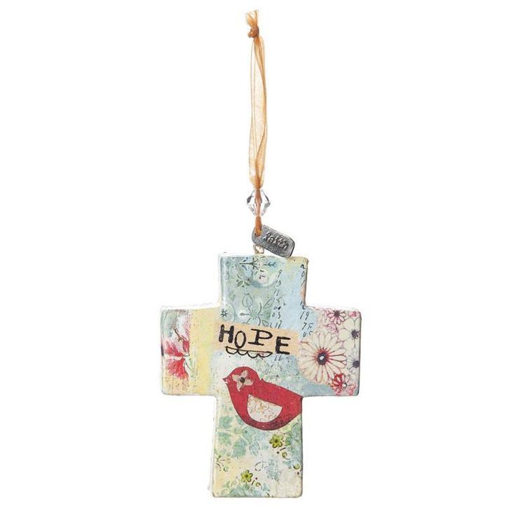 a cross shaped ornament hanging from a string with the word hope on it