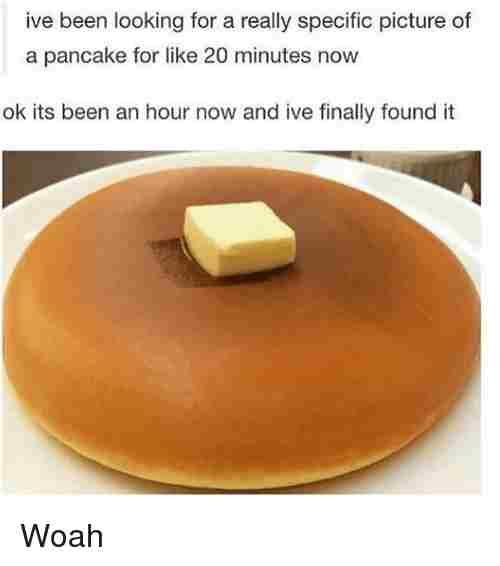 a pancake on a plate with a piece of butter sitting on top of it