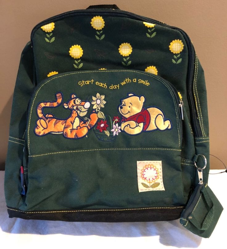 Disney Winnie the Pooh green backpack with Tigger and Winnie the Pooh on the front that reads “Start each day with a smile” comes with a mini change pouch with Winnie the Pooh on it. Has 2 compartments larger inside to hold school books and the smaller outside to hold pencils crayons markers and other miscellaneous small items.  About 15” high x 12” across x 5” deep  Never used-new without tags Winnie The Pooh Backpack, Green Backpack, Green Backpacks, Pencil Crayon, School Books, Disney Winnie The Pooh, Small Items, Winnie The Pooh, Markers