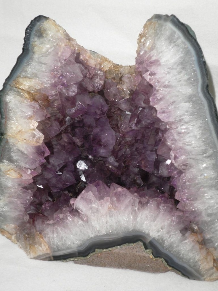 an amethorate with purple and white crystals on it