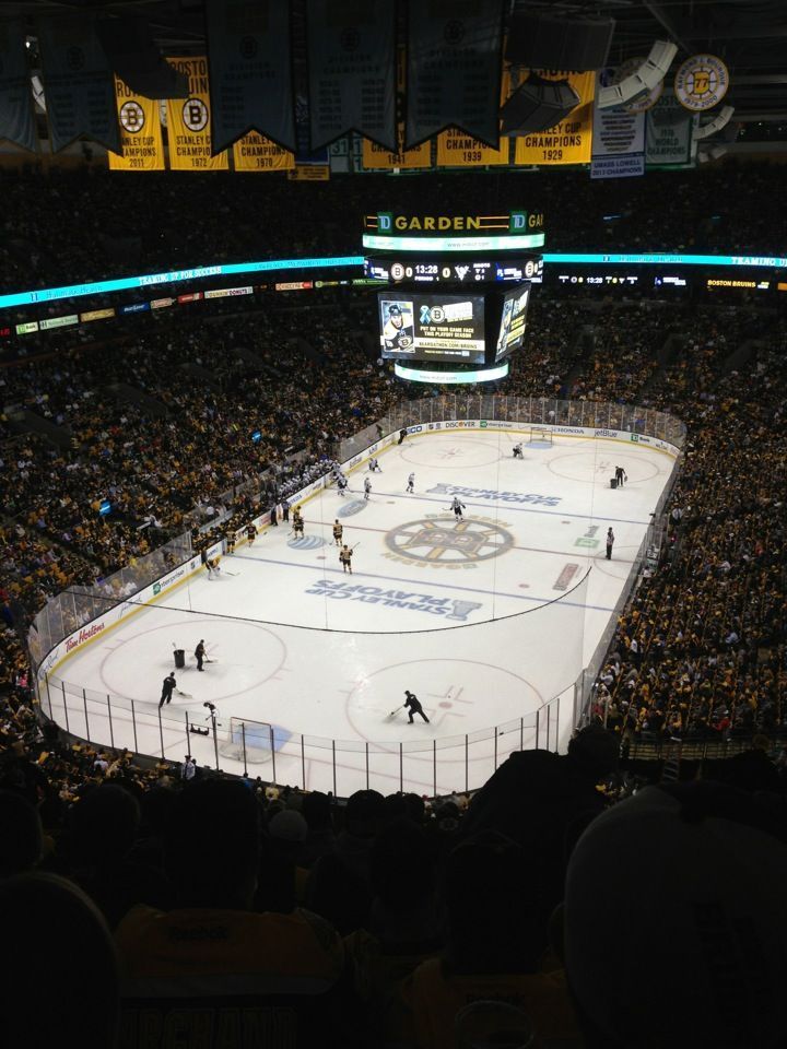 an ice hockey game is being played in a stadium