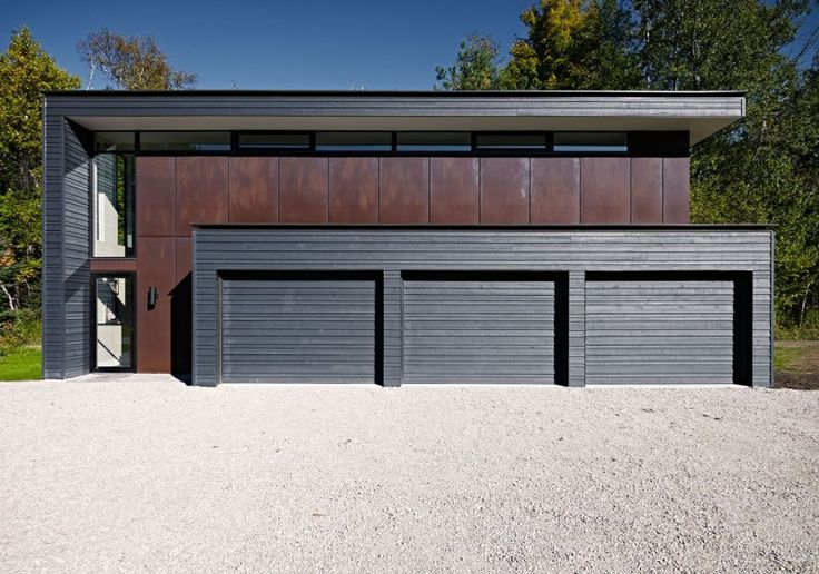 two garages on the side of a house