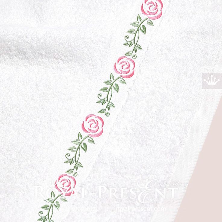 a white towel with pink roses on it