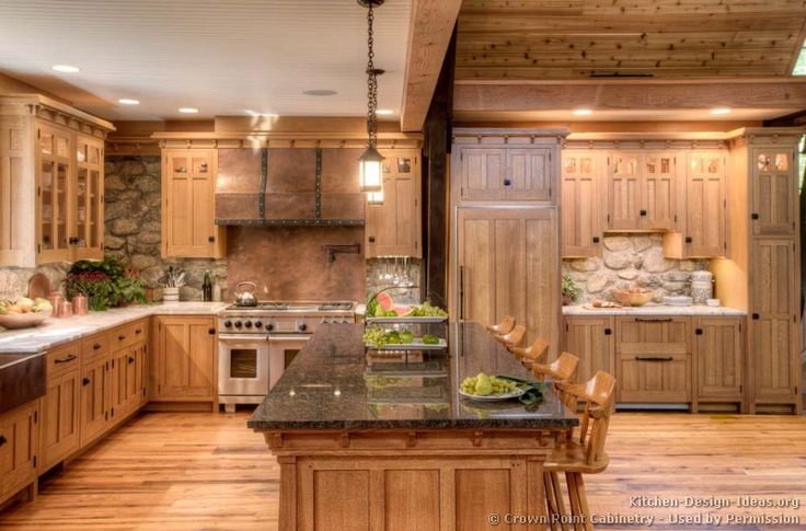 a large kitchen with wooden cabinets and granite counter tops, along with a center island