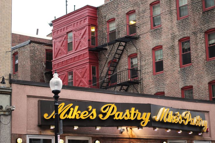 a restaurant called mike's party mixers on the corner of a city street