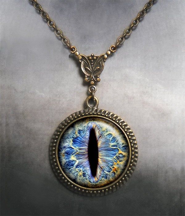 "Frost Dragon Eye Steampunk necklace (Listing 94) Amaze your friends at your next RuneScape or D&D session with this colorful Frost Dragon Eye necklace! It's been set into an Art Nouveau styled necklace for a unique bit of Victorian Steampunk vibe. We have 5 chain length available at checkout (18\", 21\", 24\", 27\" or 30\") and custom lengths are available upon request. Pendant measures 1-3/16\" across (30mm) and the artwork is covered by a crystal clear, domed glass cabochon which protects Fantasy Pendant Necklace For Cosplay, Fantasy Metal Jewelry For Cosplay, Fantasy Style Metal Jewelry For Cosplay, Adjustable Fantasy Necklaces For Gifts, Adjustable Fantasy Necklace As Gift, Adjustable Fantasy Necklace Perfect For Gifts, Adjustable Fantasy Style Necklace Perfect For Gifts, Handmade Spiritual Jewelry For Cosplay, Fantasy Metal Pendant Necklace