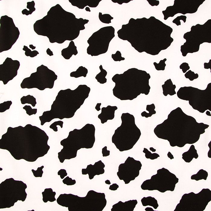 a black and white cow pattern with spots