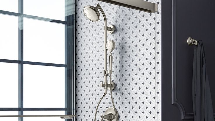 a shower head and hand shower in a bathroom