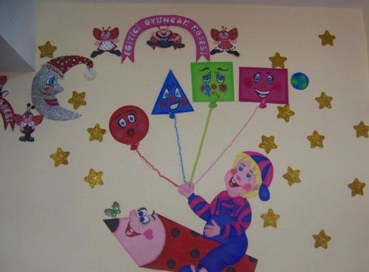 a child's room decorated with cartoon characters and balloons