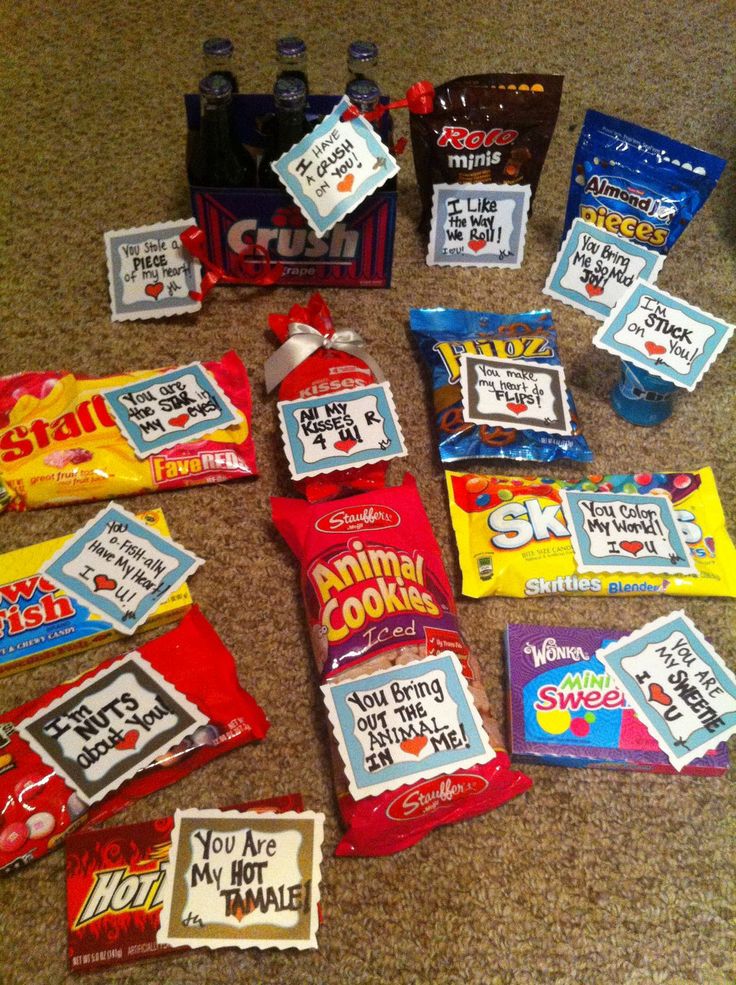 many candy bags are laid out on the floor