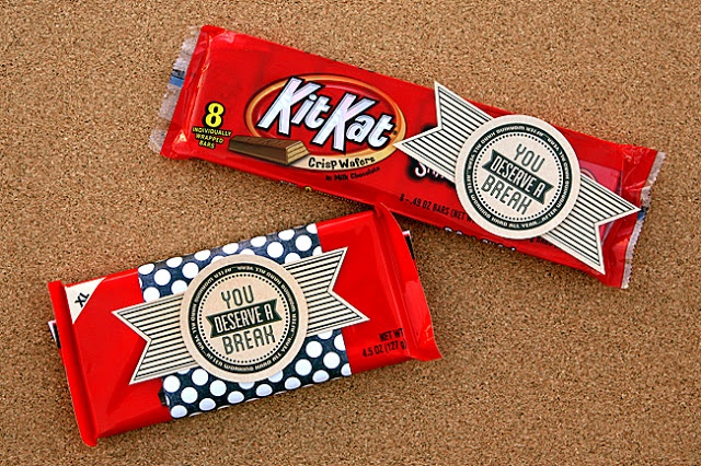 two candy bars sitting next to each other on top of a carpeted floor,