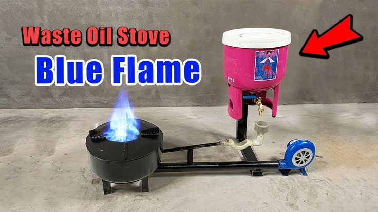 a pink and black machine with blue flame coming out of it