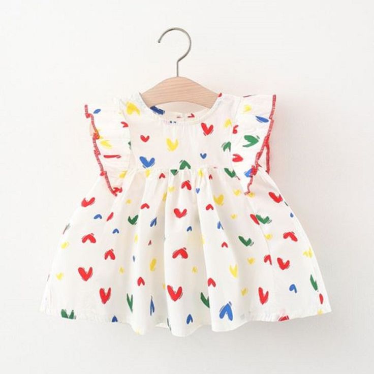 Our Be Mine Multi Heart Dress Is Perfect For Valentine's Or Any Special Occassion Such As Birthday! Playful Multicolor Dress For First Birthday, Sweet Cotton Dress For Playwear, Cotton Sleeveless Dress For First Birthday, Cute Multicolor Dress For First Birthday, Cute Multicolor Dresses For Playtime, Cute Multicolor First Birthday Dress, Cute Multicolor Flutter Sleeve Dress, Cute Multicolor Playtime Dresses, Multicolor Flutter Sleeve Dress For Playtime