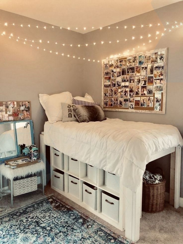 a bedroom with lights strung above the bed