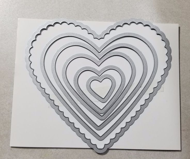 a heart shaped card with scalloped edges