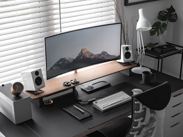 a computer monitor sitting on top of a wooden desk