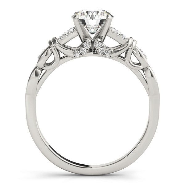 a white gold engagement ring with diamonds on the side