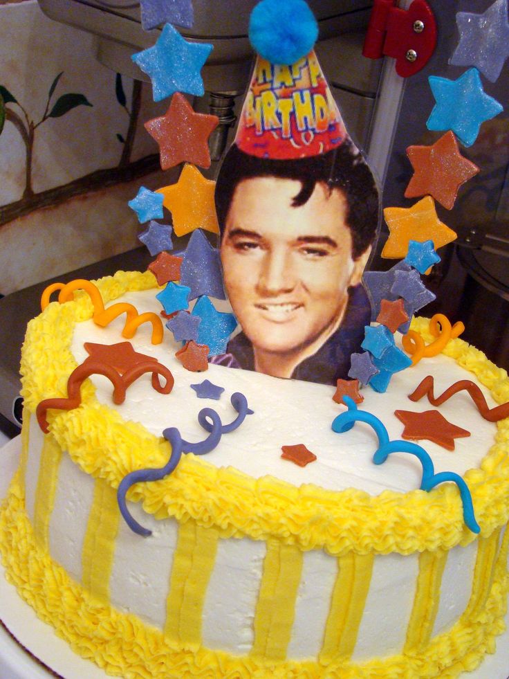 a birthday cake with an image of elvis presley on top and stars around the edges