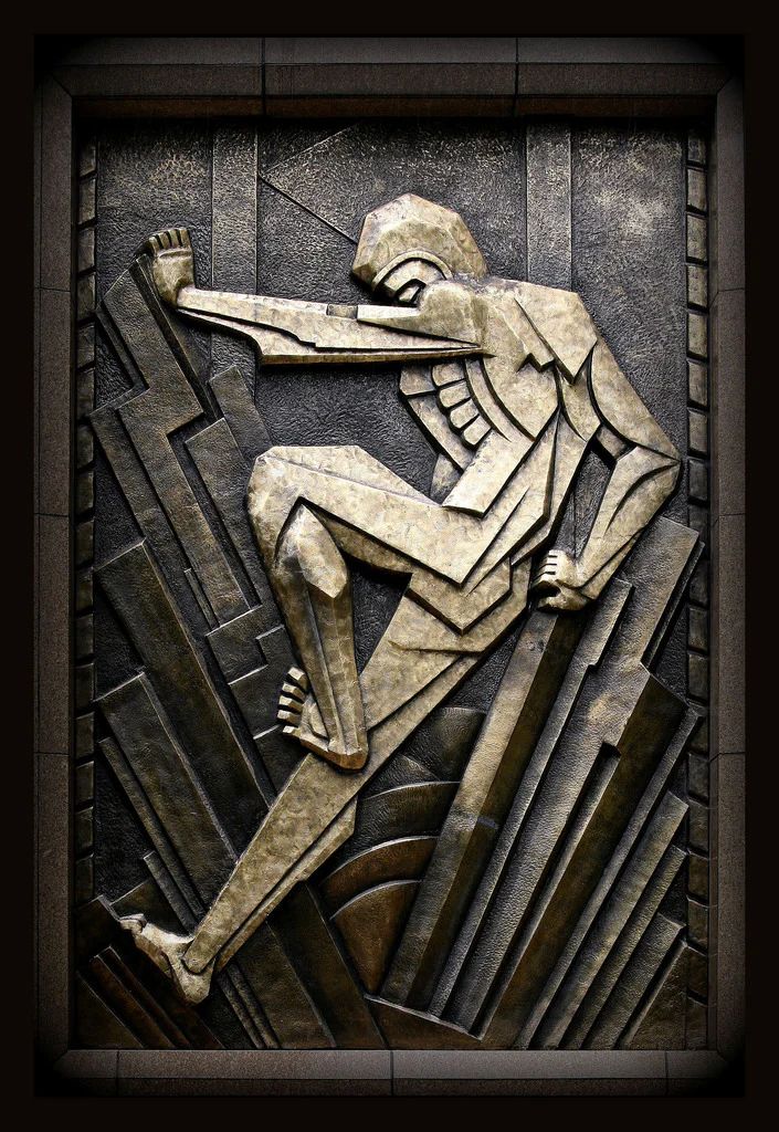 an art deco tile with a stylized image of a man on a skateboard in the air