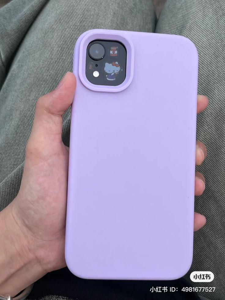 a person holding a purple phone case in their hand