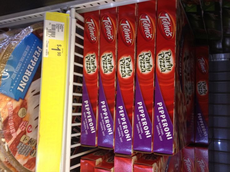 several packets of protein bars are on display in a refrigerator