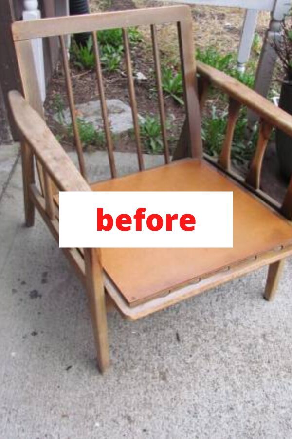 a wooden chair sitting on top of a sidewalk