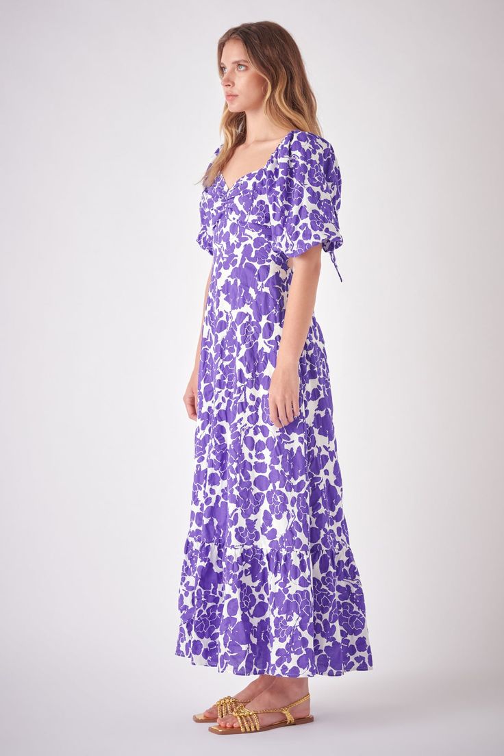 Looking for an effortless yet stylish maxi dress? Our Floral Cut-Out Maxi Dress features amazing design details that are sure to turn heads. The flattering sweetheart neckline puffy short sleeves and back cut-out make a fashion statement. Plus the entire dress is lined to make sure you're comfortable all day long. Pair with sandals and your favorite accessories and you're ready for a day of fun in the sun. Floral print Puffy short sleeves with elastic armholes Sweetheart neckline Ruched bust A-l Summer Puff Sleeve Maxi Dress, Summer Maxi Dress With Puff Sleeves, Puff Sleeve Ruched Maxi Dress For Garden Party, Vacation Maxi Dress With Fitted Bodice, Fitted Maxi Length Puff Sleeve Dress For Day Out, Fitted Bodice Maxi Dress For Vacation, Summer Puff Sleeve Maxi Dress For Brunch, Flowy Ruched Puff Sleeve Dress, Flowy Puff Sleeve Dress With Ruched Detail