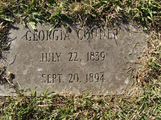 a headstone in the grass that says george conner