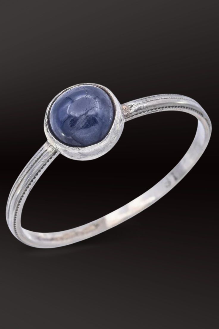 Elevate your style with this elegant antique 18K white gold ring boasting a mesmerizing 1.56 Ct sapphire round cabochon. A timeless piece for sophisticated allure. #SapphireJewelry #AntiqueGold #VintageStyle Classic Sapphire Cabochon Rings, Classic Oval Cabochon Sapphire Ring With Bezel Setting, Classic Sapphire Ring With Oval Cabochon Bezel Setting, Fine Jewelry White Gold Cabochon Sapphire Ring, Domed Sapphire Ring As A Gift, Fine Jewelry Round Cabochons With Bezel Setting, Round Fine Jewelry Cabochons With Bezel Setting, Round Cabochons With Bezel Setting Fine Jewelry, Classic Round Cabochons With Bezel Setting