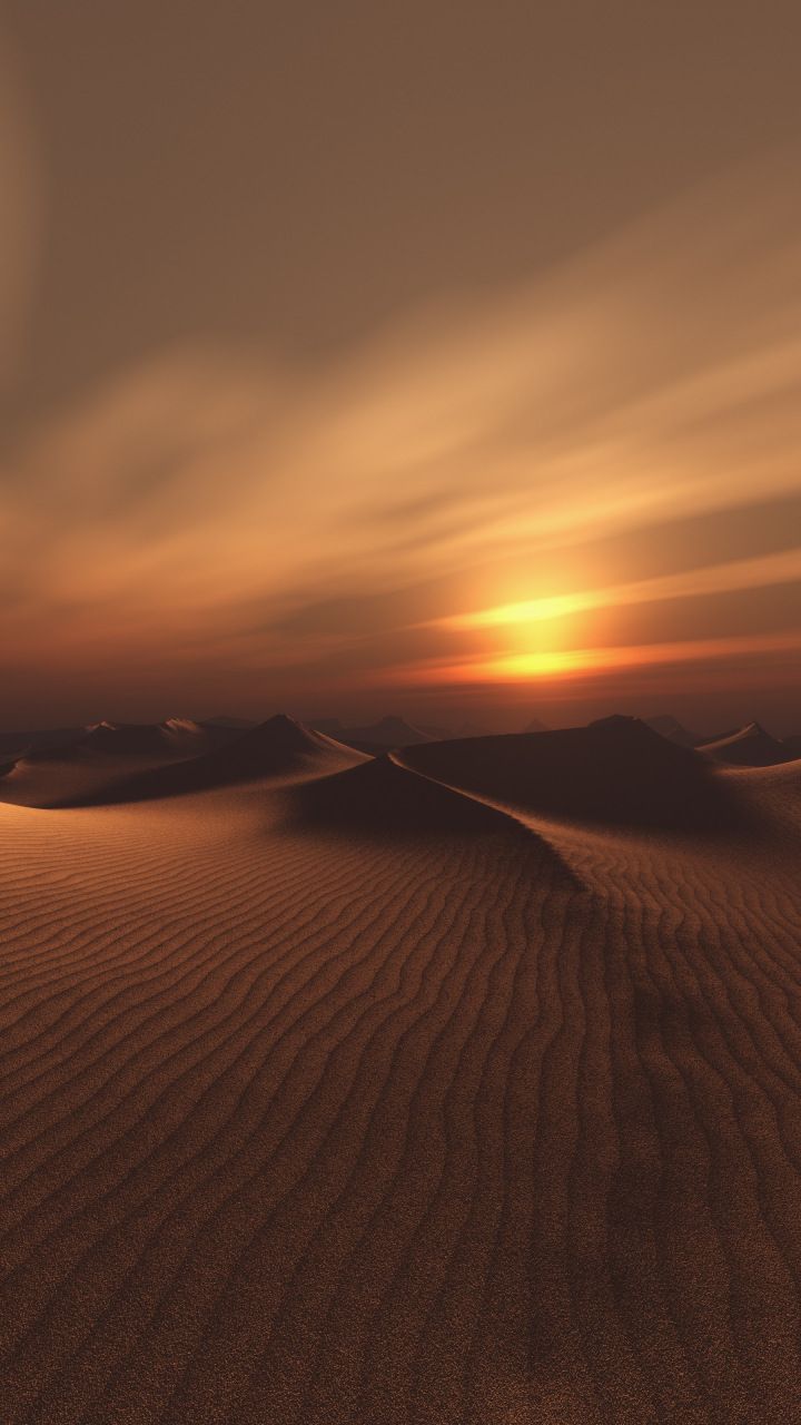 the sun is setting over some sand dunes