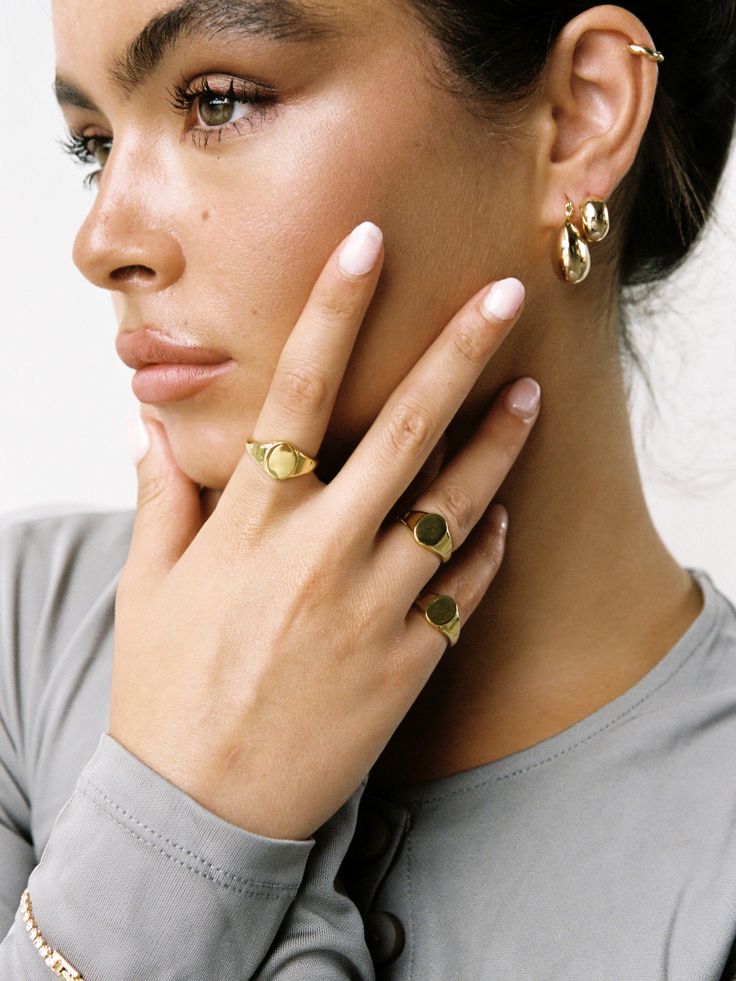 The 14k Gold Filled Signet Ring is our modern take on the classic signet style that has been around for decades. A perfect statement ring, or addition to your pinky, our 14k Gold Filled Signet Ring will become an heirloom in your capsule collection. Details 14k Gold Filled Available in 5 sizes Can be engraved Please note that as all items are handmade to order, please allow for 1-3 days of handcrafting before despatch. However, if you wish to have your item fast-tracked, please email us at contact@loveisabelle.com where we will be more than happy to assist you. If purchasing more than one item, and require individual boxes for your jewellery, you can purchase them here. Everyday 14k Gold Oval Jewelry, Timeless Everyday Yellow Gold Initial Ring, Everyday Yellow Gold Plated Signet Ring, Timeless Everyday Initial Ring Tarnish Resistant, Everyday Tarnish Resistant Initial Ring, Everyday Gold Plated Open Signet Ring, Heirloom 14k Gold Initial Ring For Everyday, Fine Jewelry Signet Ring With Smooth Bezel, Everyday Yellow Gold Recycled Gold Signet Ring