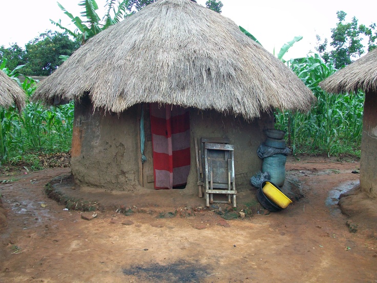 a small hut with thatched roof and doors