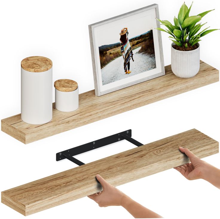 two wooden shelves with pictures and candles on them, one is holding a photo while the other holds a potted plant