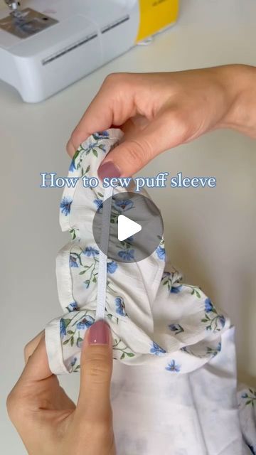 someone is sewing on a white shirt with blue flowers and the words how to sew ruffle sleeves