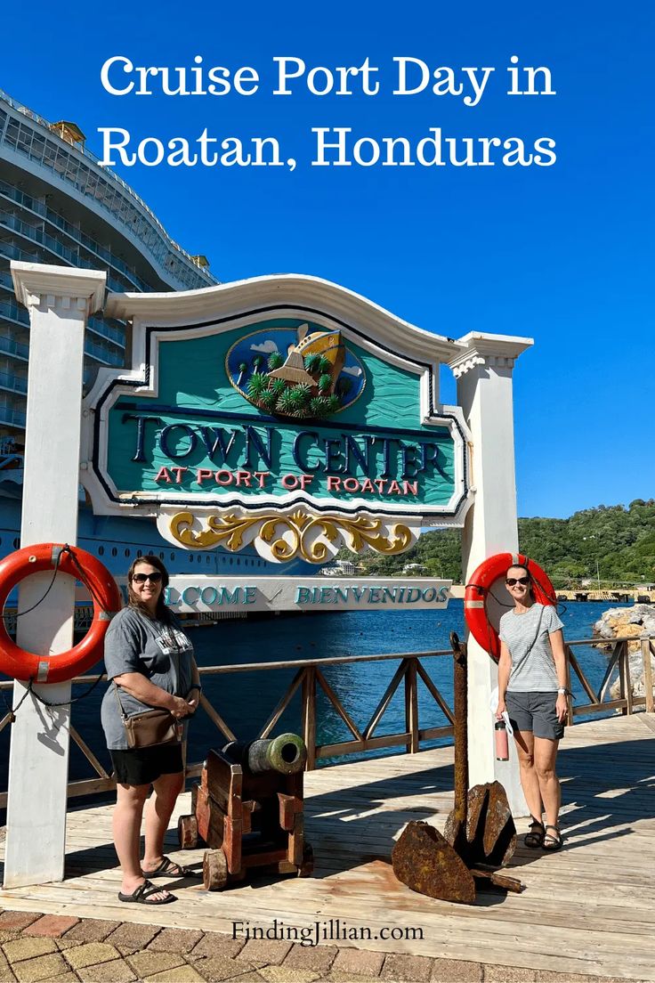 two people standing in front of the sign for cruise port day in roatan, florida