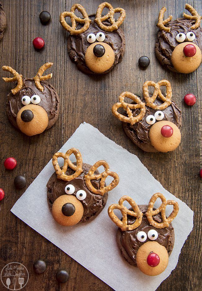 reindeer cookies with chocolate frosting and pretzels on top