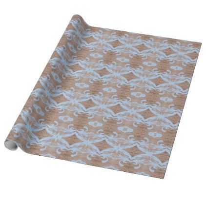 a brown and blue wrapping paper with an ornate design on it's side,