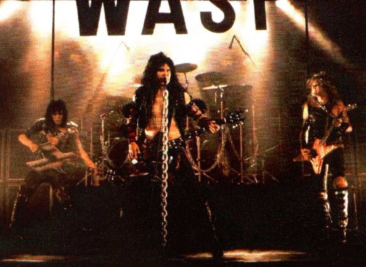 the band was performing on stage in front of a large sign that says wash it