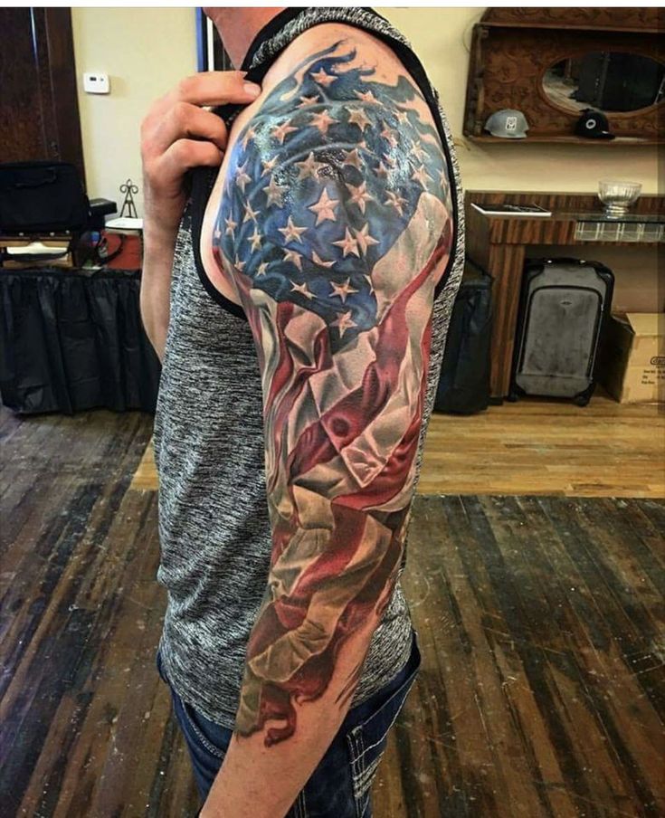 a man with an american flag tattoo on his arm