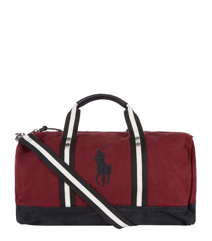 a red duffel bag with black and white stripes on the bottom, featuring a polo logo